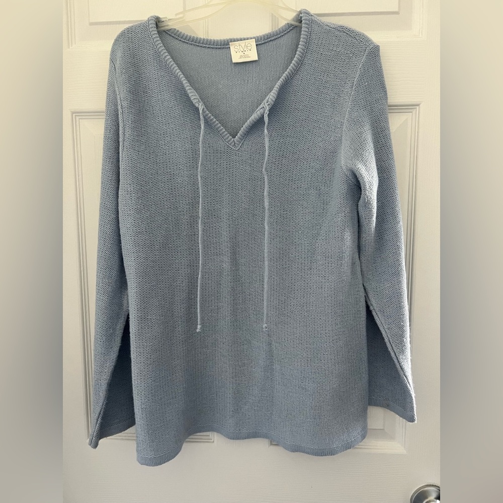 Size medium style studio light blue sweater.  Lightweight.  Drawstring at neck.